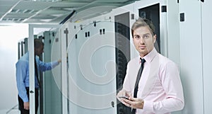 It engeneer talking by phone at network room