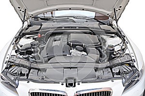 Engine of BMW 335i car - bonnet open position