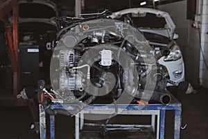 An engine in a car repair garage