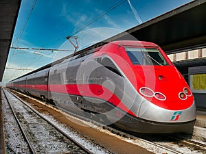 A Trenitalia national rail operator, Italy Frecciarossa red arrow high speed train in Venice