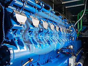 Engine of CHP unit. Diesel and gas industrial electric generator photo