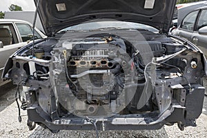 Engine Compartment of a worthless car missing parts