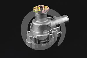 Engine cooling pump, mechanically driven cooling pump for a truck, black background, selective focus photo