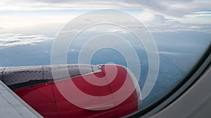 The engine cowling of airplane on the beautiful cloudy and sky