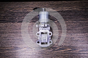 Engine EGR valve image on wooden background