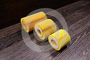 Engine filters on wooden background