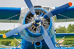 Engine with four blade propeller and pilots cabin of soviet aircraft biplane Antonov AN-2 closeup