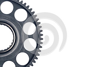 Engine gear wheel with cogs, white background with copy-space