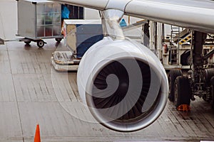 jet engine against a plane at the airport on loading