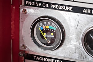 Engine oil pressure gauge on the control panel.