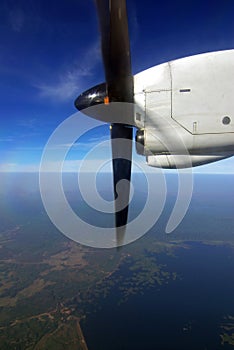 Engine and propeller of the plane on the blue sky