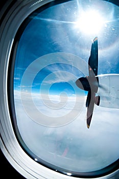 Engine and propeller of the plane, view from window airplane