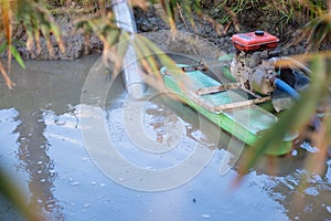 Engine pumping water from river into the rice fields, agriculture technology
