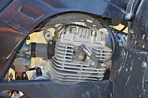 engine on a quad bike,ATV piston and carburetor close-up