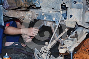 Engine repair,Mechanic working in a car under the hood.