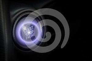 Engine start button in car with light