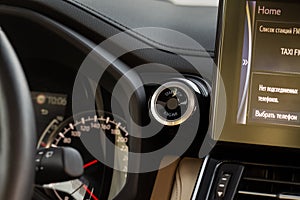 Engine start button with fingerpint close up.