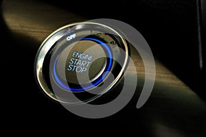 Engine start button in modern car close