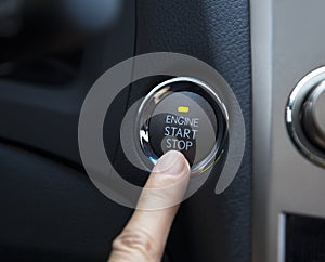 Engine start stop button of a car photo