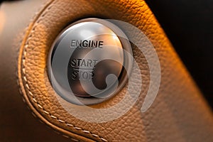 Engine start and stop button in luxury sport car close-up view
