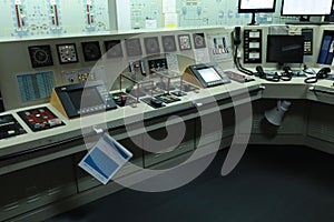 Engine surveillance monitors in engine room of ship