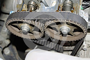 Engine timing belt on camshaft cogwheels