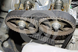 Engine timing belt on camshaft cogwheels photo