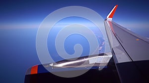 Engine Wing airplane sky concept. View of engine plane from window airplane see wing and sky and cloud sunset beautiful.
