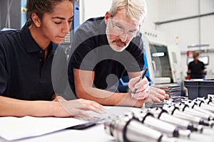 Engineer And Apprentice Planning CNC Machinery Project photo