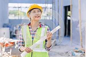 Engineer Architect builder Asian smart woman worker pride in work at construction site happy smiling