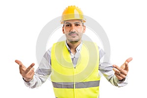 Engineer architect or builder making ask question gesture