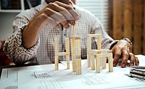 Engineer architect concept with wood building design construction project of business man photo