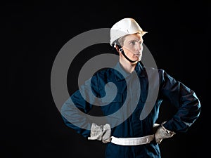 An engineer or architect on a construction site, a man in a robe