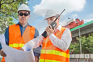 Engineer and Architect or Foreman wear white hardhat and Glow sa