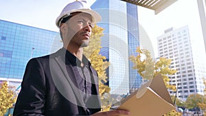 Engineer architect inspect and authorize work construction site. Contractor checking issues with a blueprint, papers and