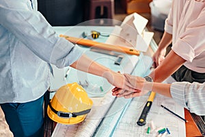 Engineer and architect partners team work join hands together. group people hands were collaboration to trust in business
