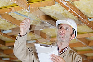 Engineer or architect pointing at ceiling