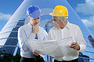 Engineer architect two expertise team plan hardhat photo