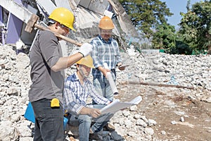 Engineer architect and worker operation control demolish old building