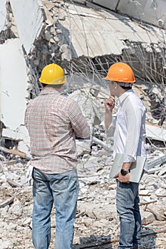 Engineer architect and worker operation control demolish old building