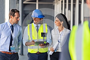 Engineer and architects at construction site