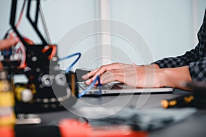 Engineer Asian Students Assembling Robotics Kits. Learning Mechanical Control by Computer, Robotics combines computer, electrical