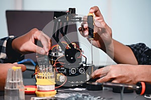 Engineer Asian Students Assembling Robotics Kits. Learning Mechanical Control, Robotics combines computer, electrical, mechanical