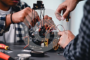 Engineer Asian Students Assembling Robotics Kits. Learning Mechanical Control, Robotics combines computer, electrical, mechanical