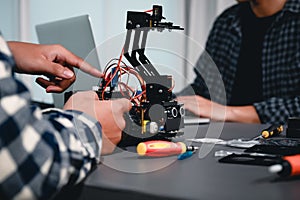 Engineer Asian Students Assembling Robotics Kits. Learning Mechanical Control, Robotics combines computer, electrical, mechanical