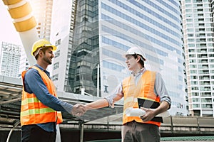 Engineer Boss get handshake, saying thank you to blue collar worker or team for doing work successfully. Employee happy. Blue