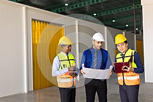 engineer builder team working with architect designer work inspect large building factory construction project with floorplan