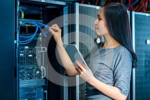 Engineer businesswoman in network server room