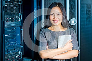 Engineer businesswoman in network server room