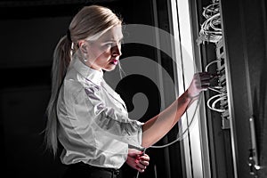 Engineer businesswoman in network server room